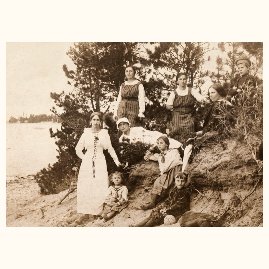 A family vacation at Lake Baikal. At the top left is my Auntie Mania, and leaning on her elbow is my mother Grunia.